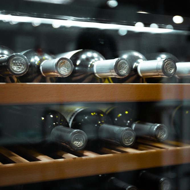 Storing,Bottles,Of,Wine,In,Fridge.,Alcoholic,Card,In,Restaurant.